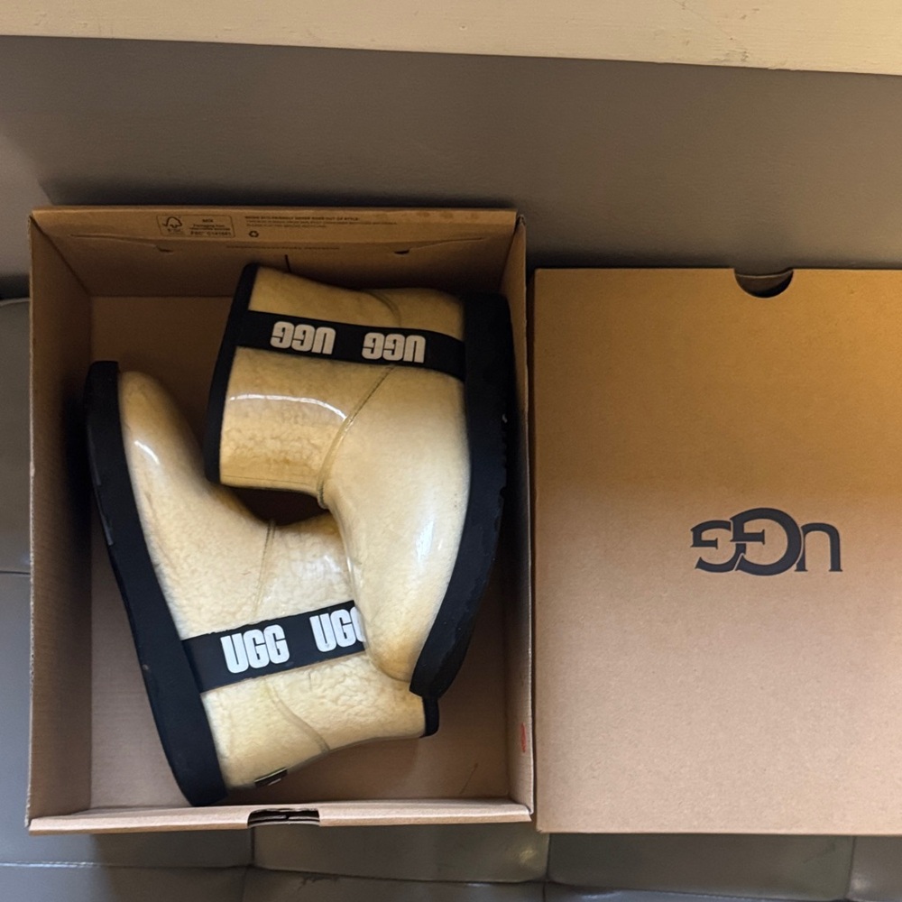 UGG Cream Shearling Boots with Black Trim